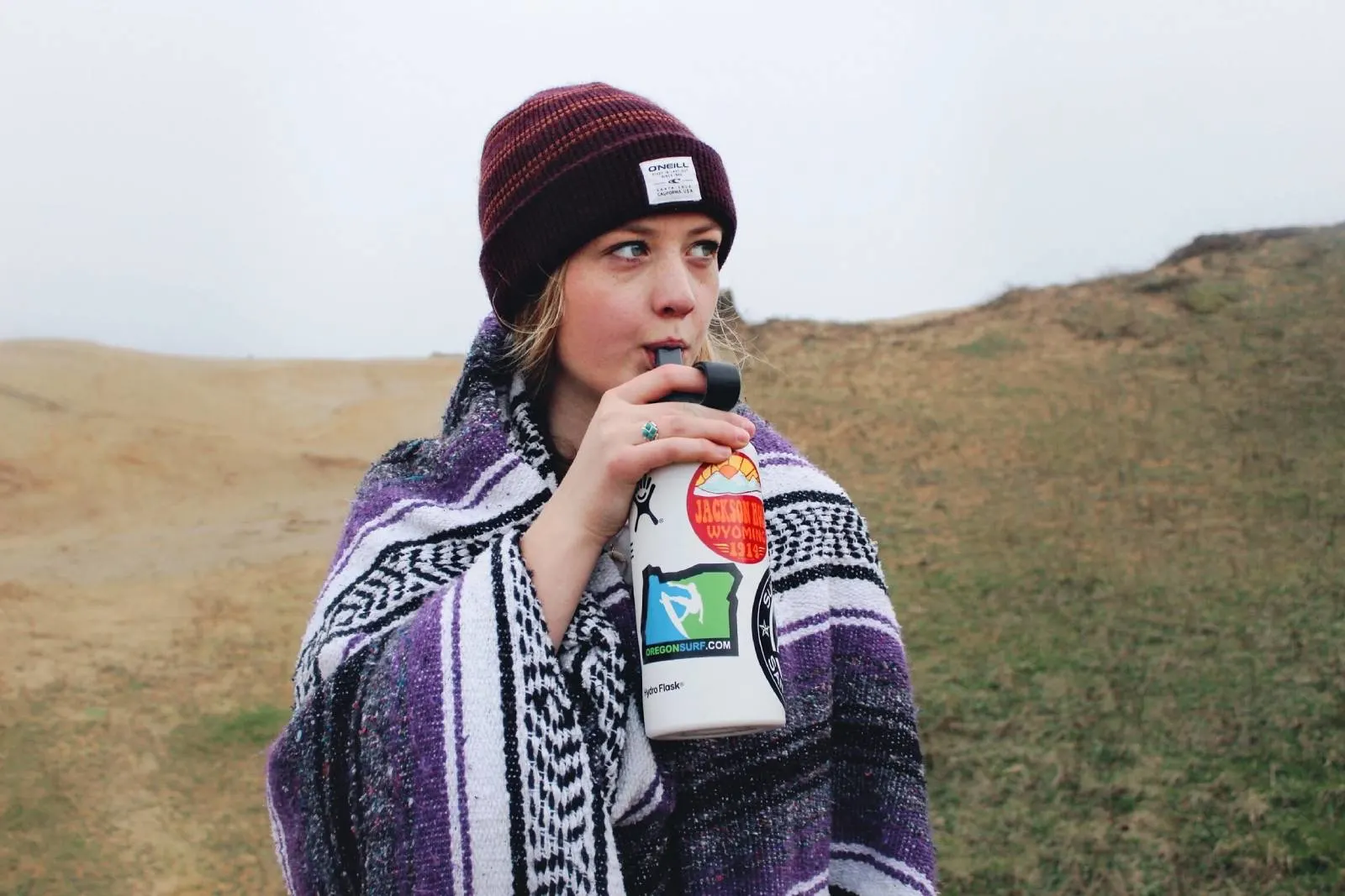 Woman drinking water out of a water bottle - Top 7 Tips to Stay Active